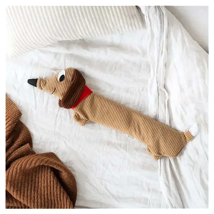 Almofada de aquecimento com a forma de um dachshund